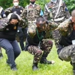 Erick Thohir saat latihan jadi anggota banser